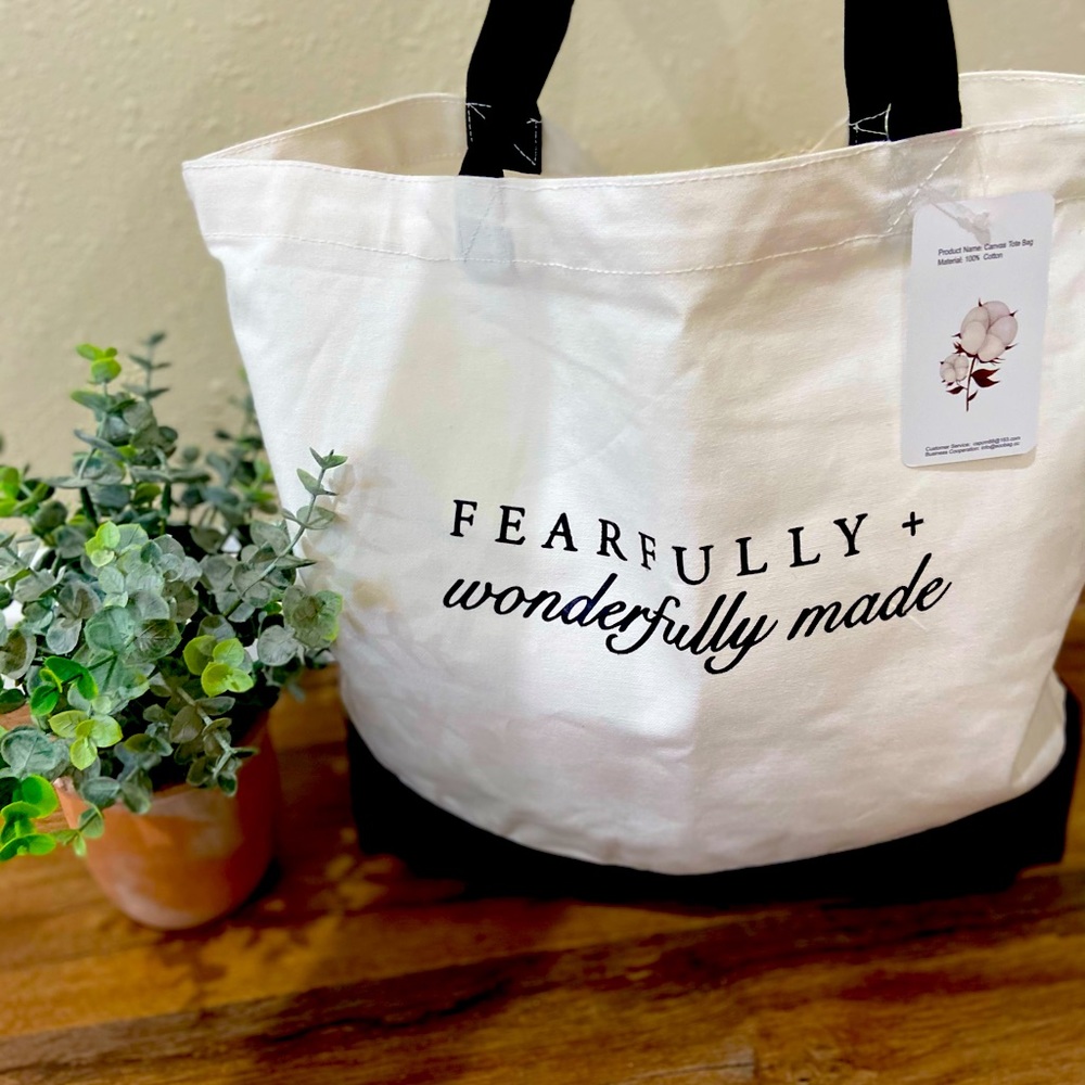 Cute white and black cotton tote washable great to carry on. Last one